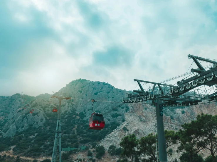 a train on train tracks near trees and a mountain