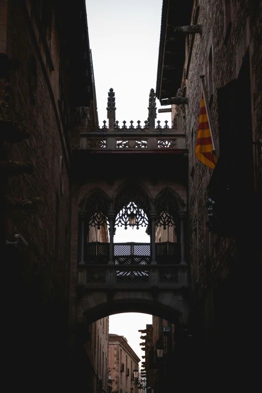 a street under a bridge in an alley