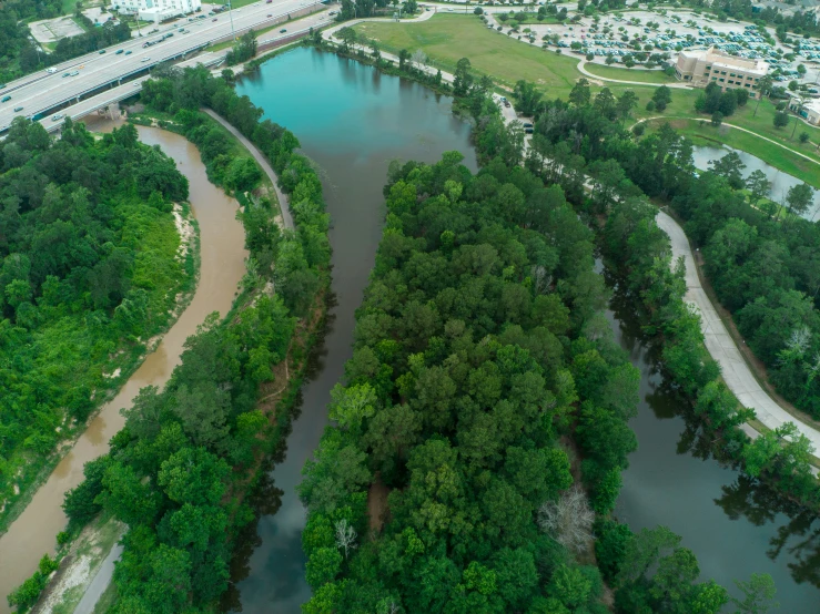 the aerial view shows the river and road in the distance