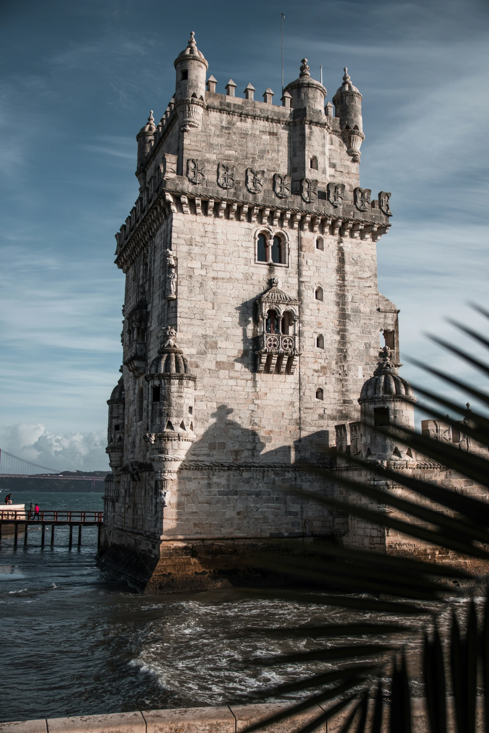 there is a large stone castle built by water