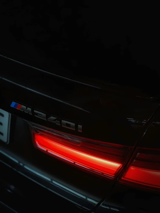 the back of a bmw car at night