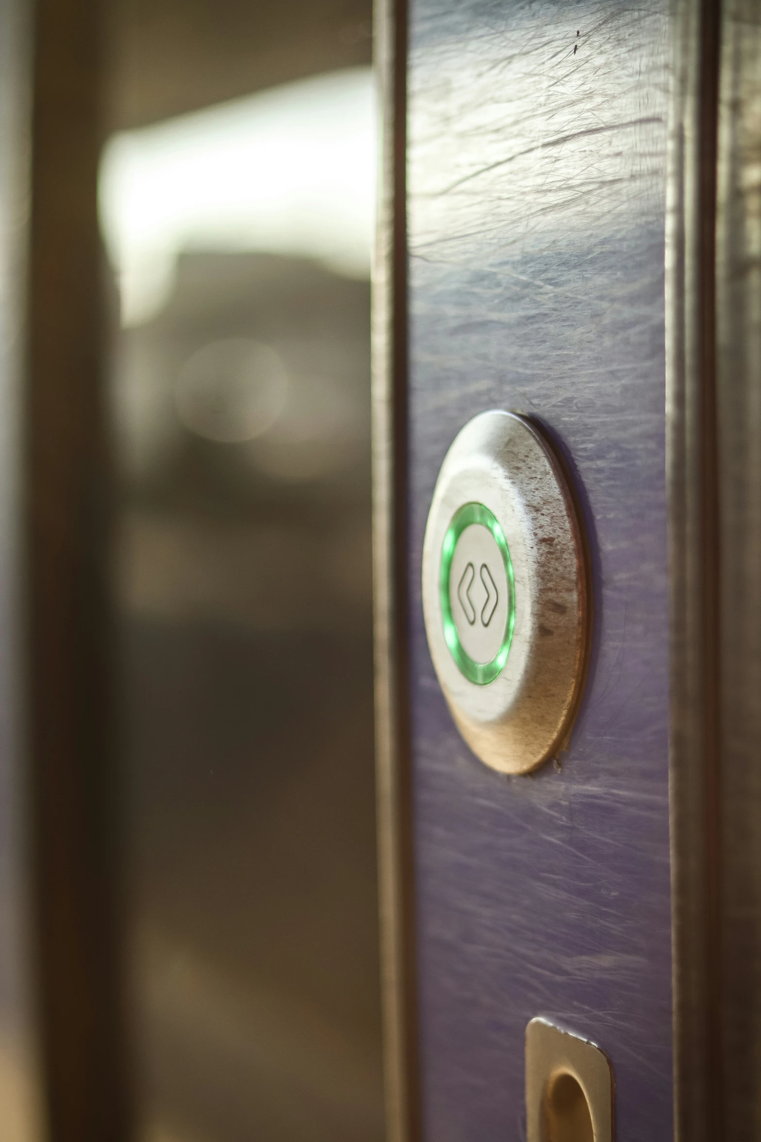 a wood paneled wall with a on and key