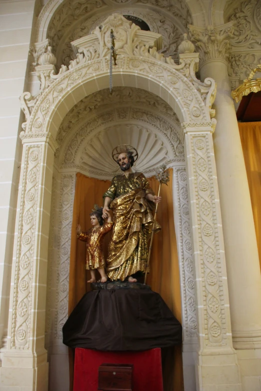 statue of saint mary on the altar in the church