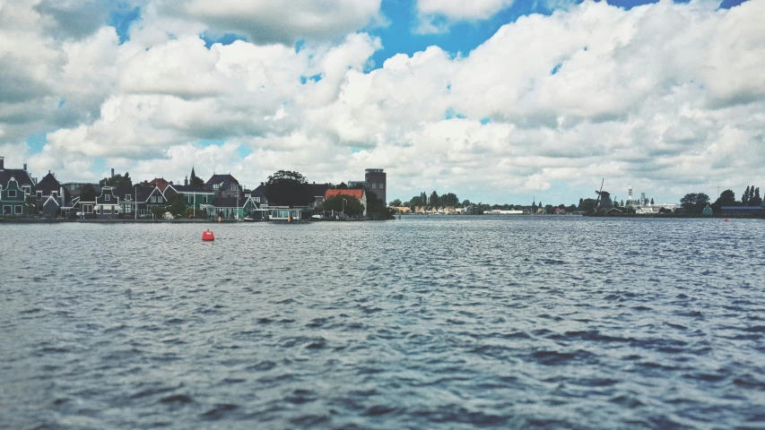 the view of some houses near the ocean