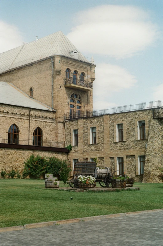 an older building with lots of windows and an iron fence