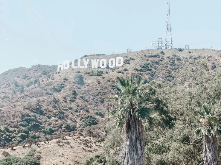 the hollywood sign is located on the top of a hill