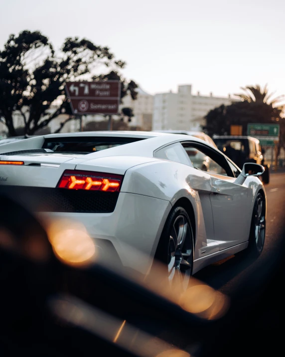 a car drives along a road during the day