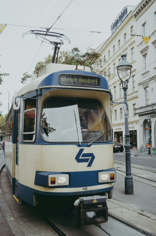 a bus on a city street next to a lamp post