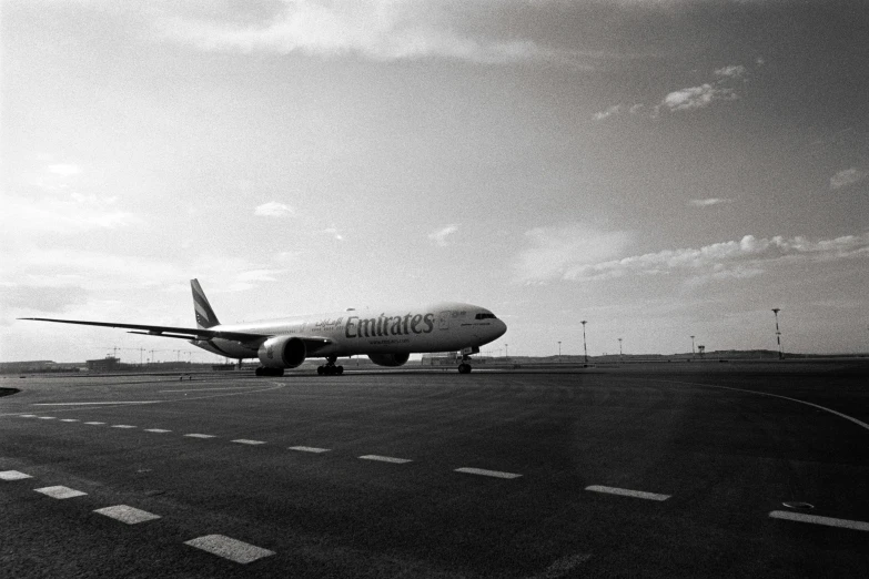 an airplane is preparing to take off in black and white