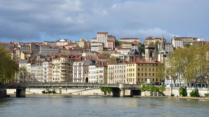 a view of buildings with a bridge over water