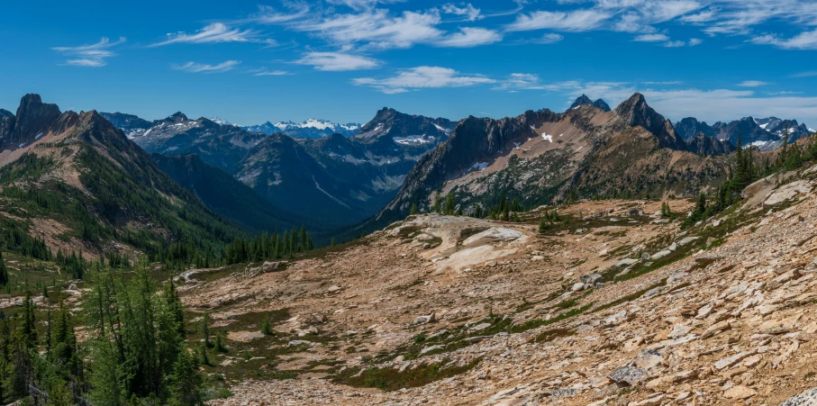 a mountain that is covered in rocks and grass