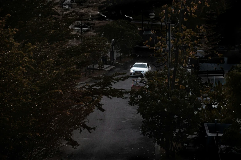 an suv parked on the street in the dark