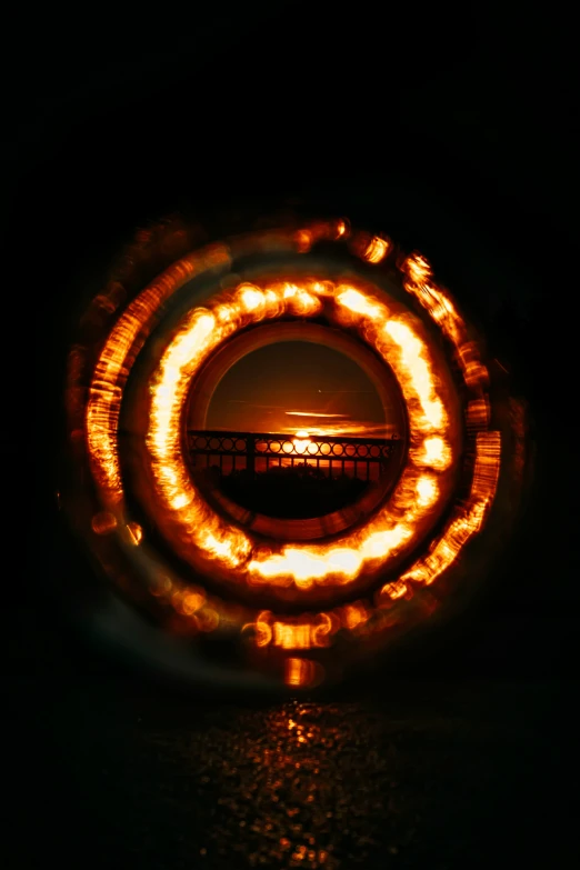 a fire can seen in the center of a circular object