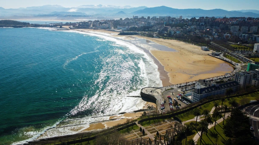 an aerial view of a beach next to the ocean