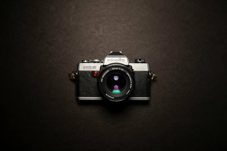 a camera is shown sitting on a black background