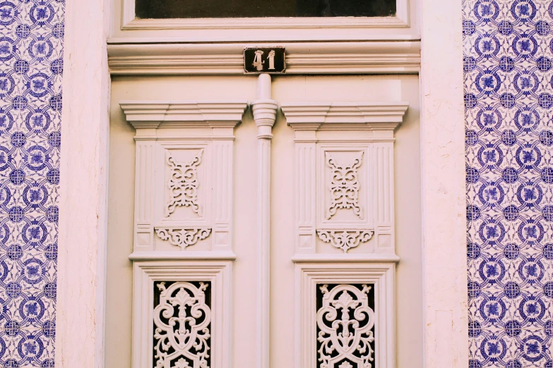 a close up view of a window and a wall with patterns