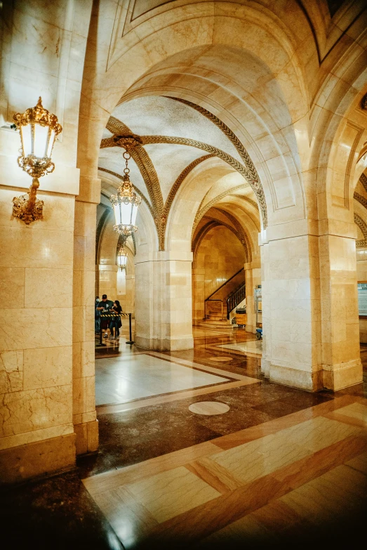 large ornate pillars line the entry hall of a el