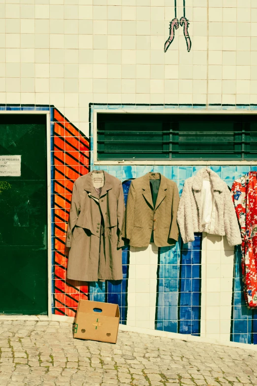 clothes and clothes hanging out on a rack outside