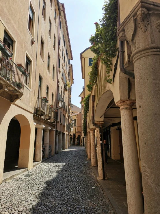 an empty street lined with buildings in the center of town