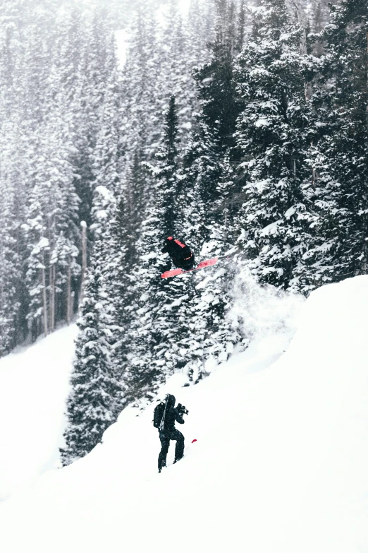 a man flying through the air while riding skis