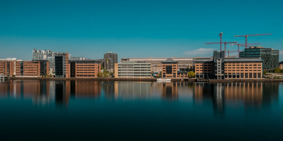 an area with lots of tall buildings on the water