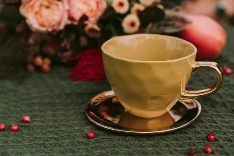 a yellow coffee cup is sitting on a saucer