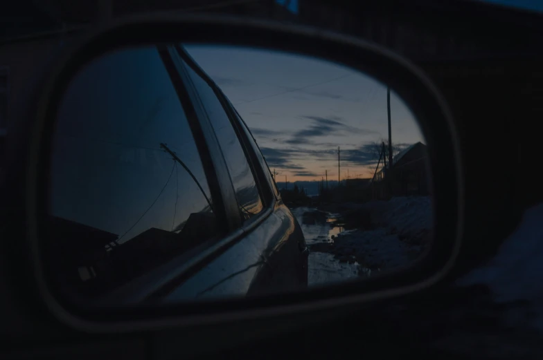 the side view mirror of a car as seen from it