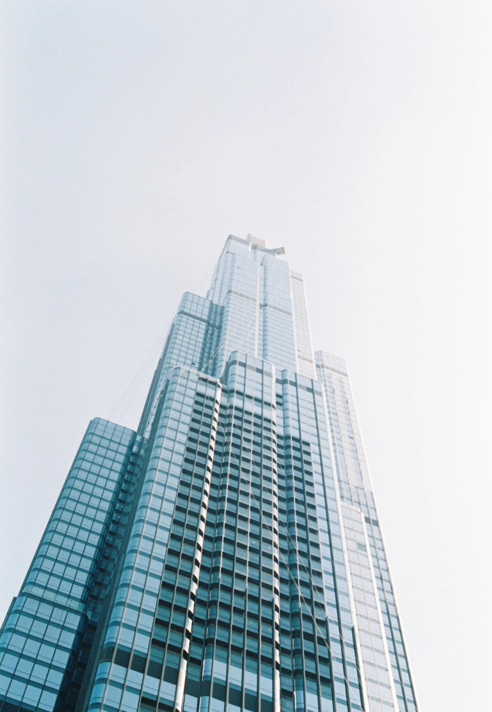 a very large office building that looks down in the sky