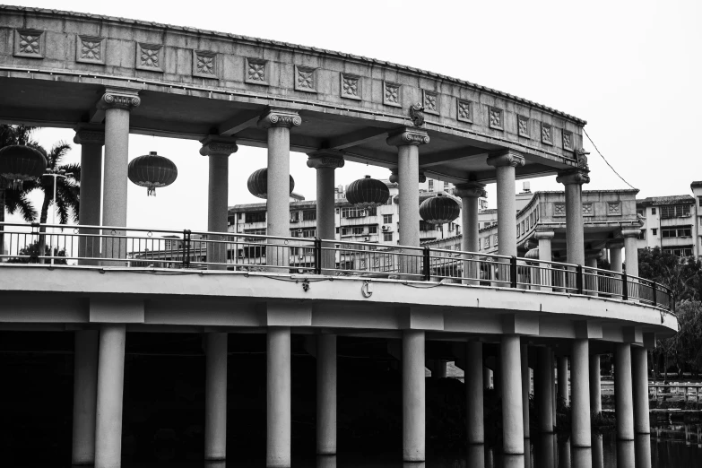 many large vases hold clocks on the balconies