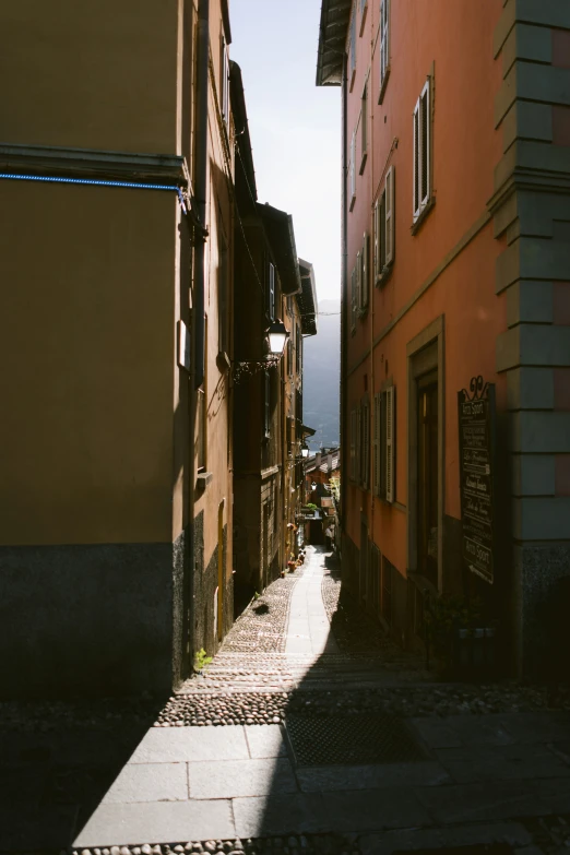 a narrow alley leading up to two buildings