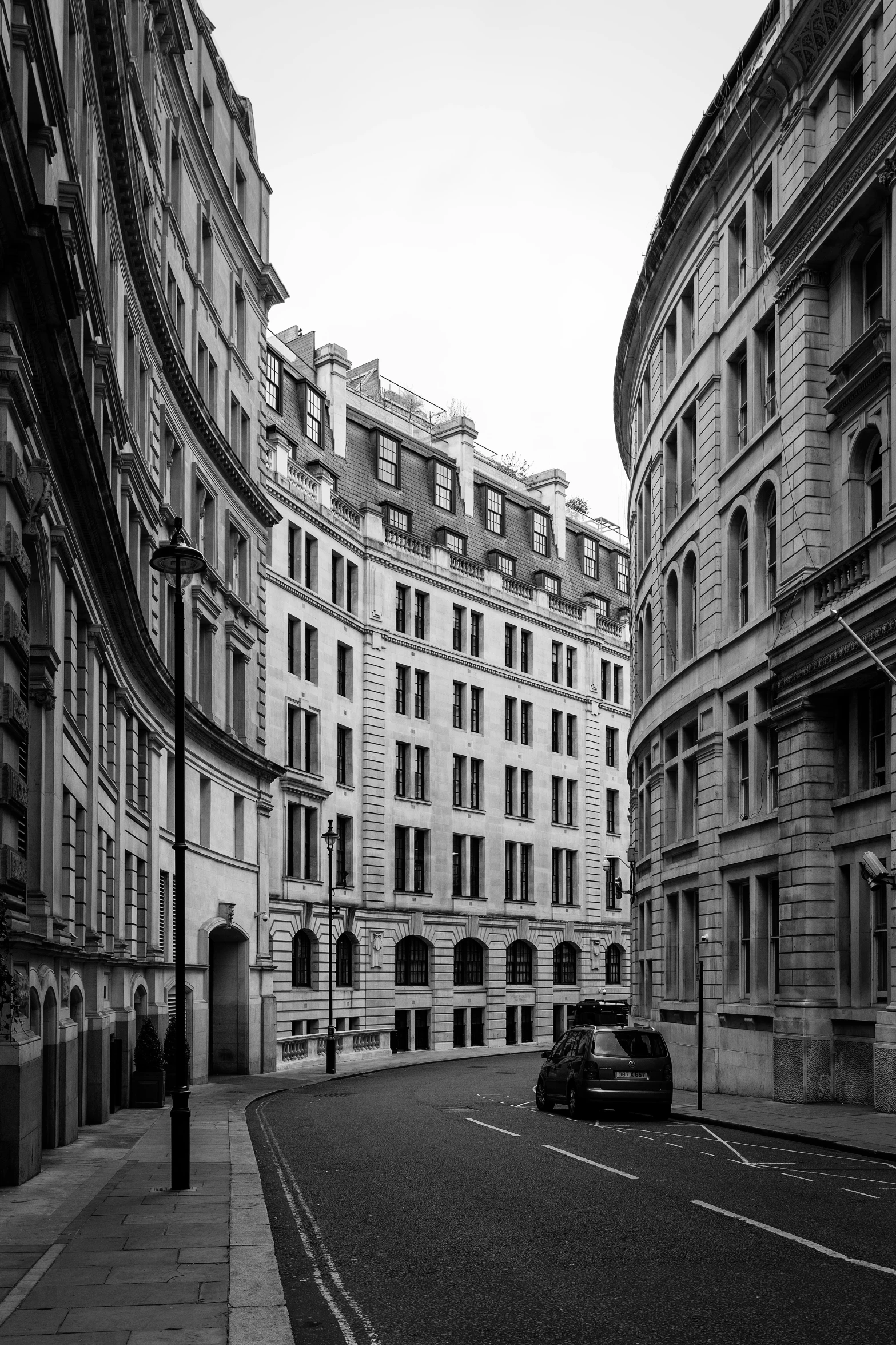 a street scene with some cars and buildings