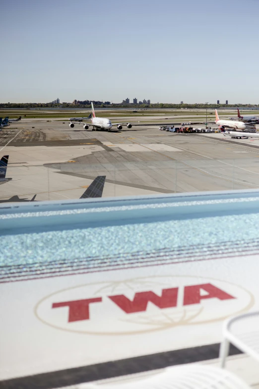 airplanes are parked in a parking lot at an airport