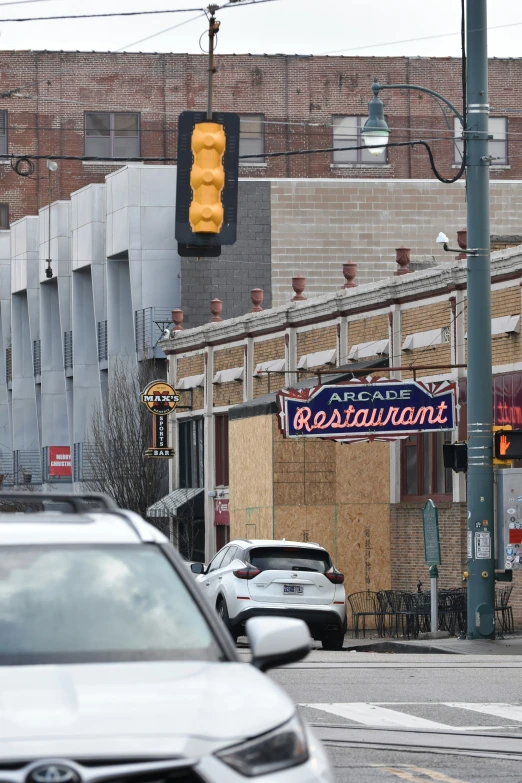 a traffic signal that reads broadway next to some buildings