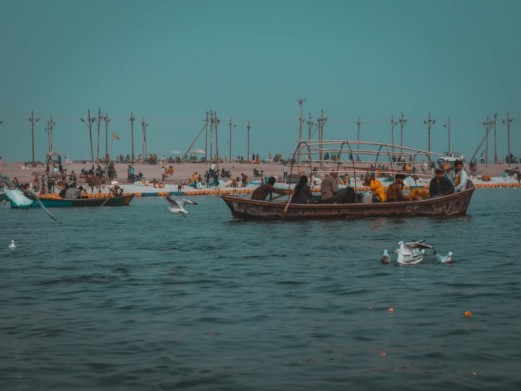 a number of small boats in a body of water