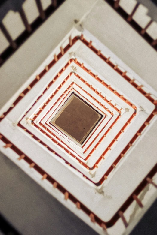 a close up of a decorative ceiling with square objects