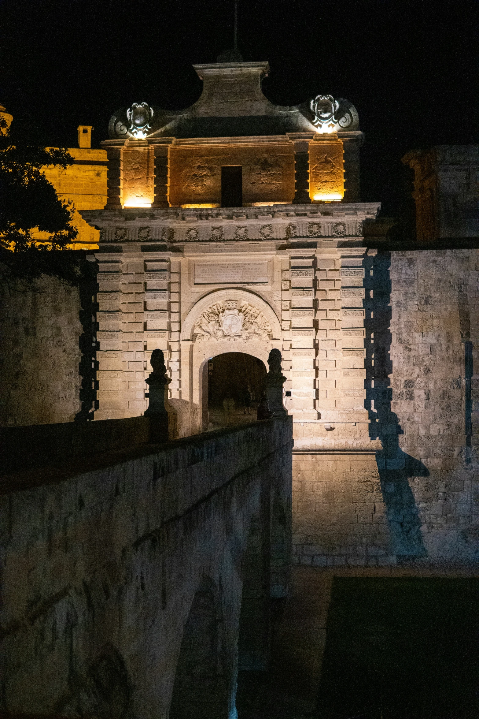 an old looking clock tower in the night time