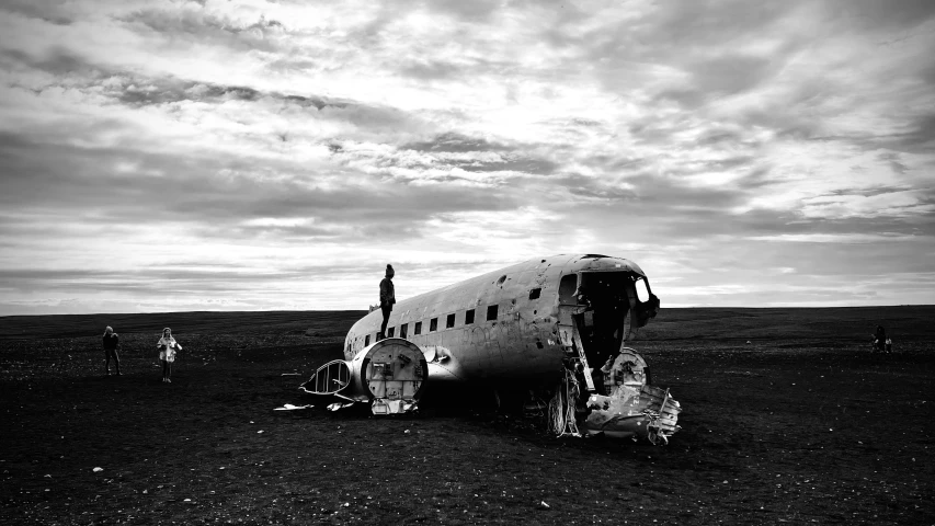 two men are standing on top of an airplane