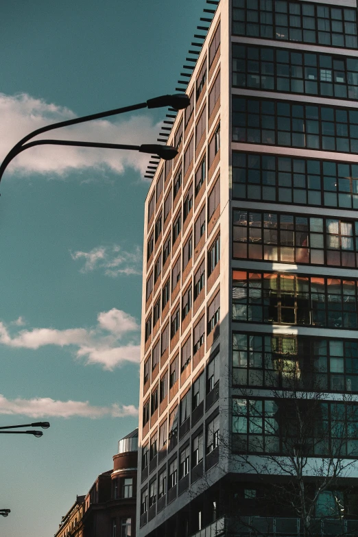 an apartment building sitting under a traffic light