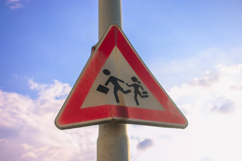 a street sign warning drivers about climbing