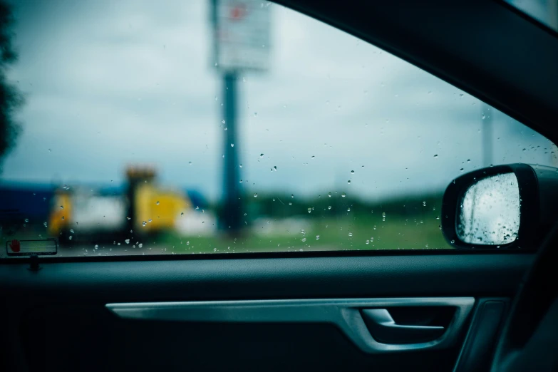 side view mirror with car's reflection in it