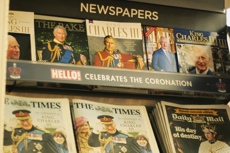 many magazines are lined up together on a shelf