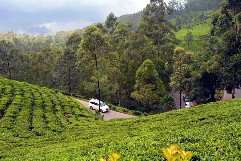 a van in a mountainous area, with a highway