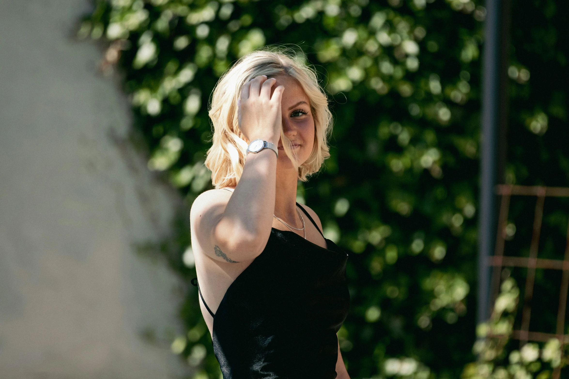 a woman standing with a very big black dress