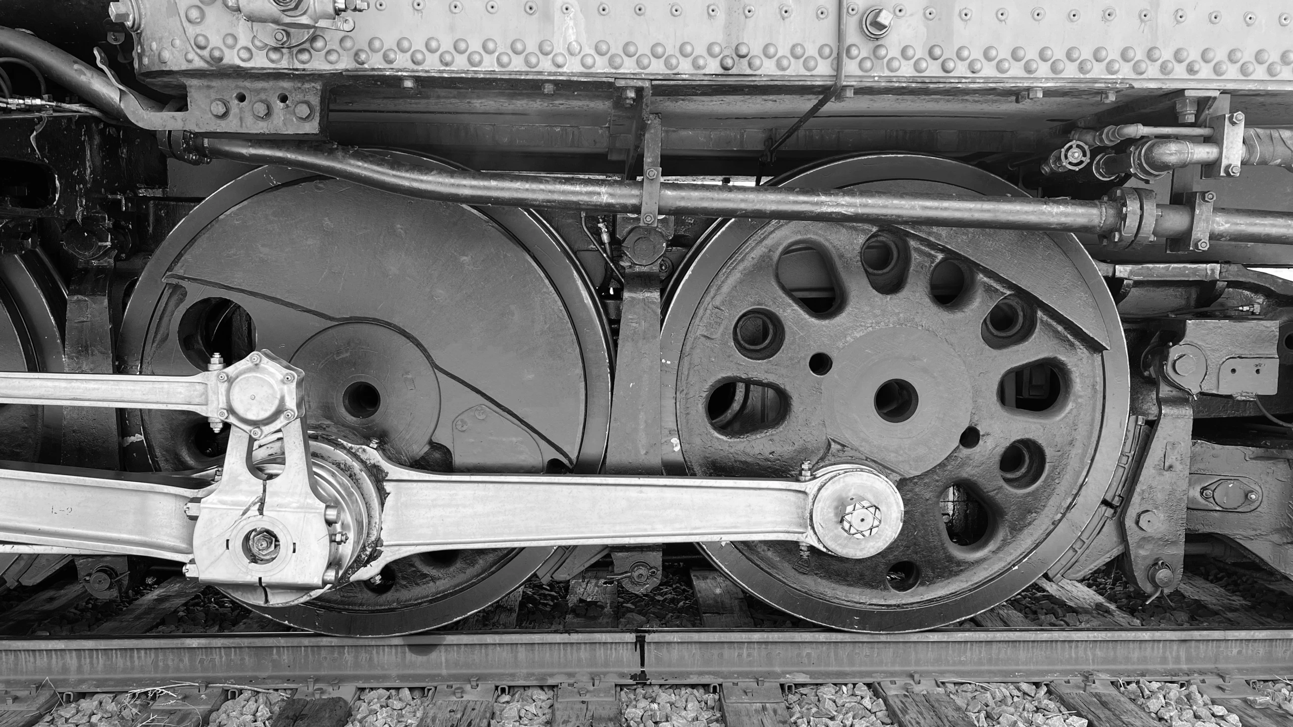 the bottom of an old steam engine on tracks