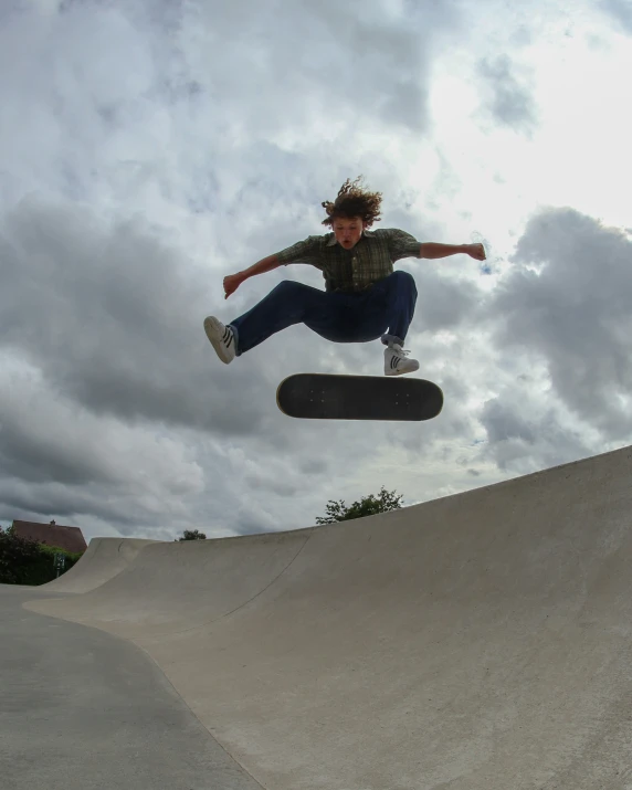 the skateboarder is jumping in the air