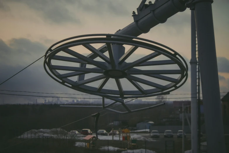 an industrial object suspended on the side of a power line