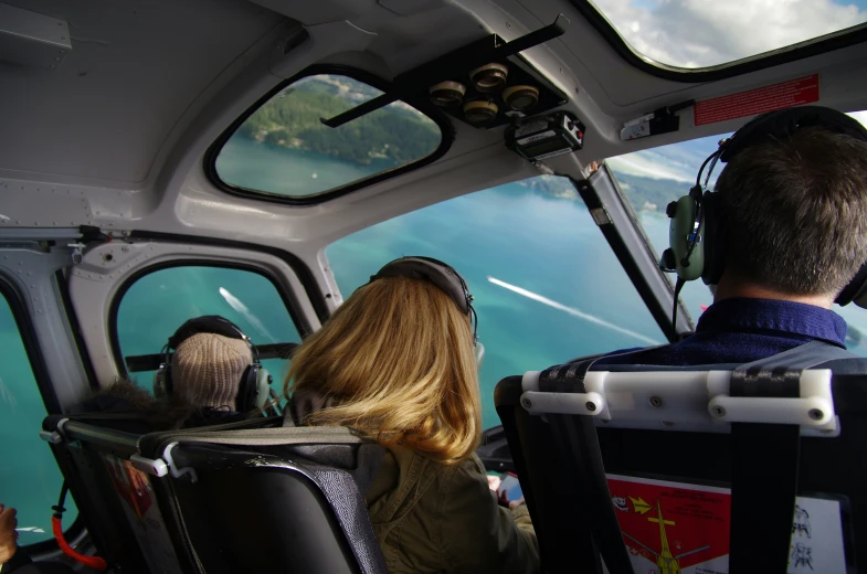 two people are in the cockpit of an airplane