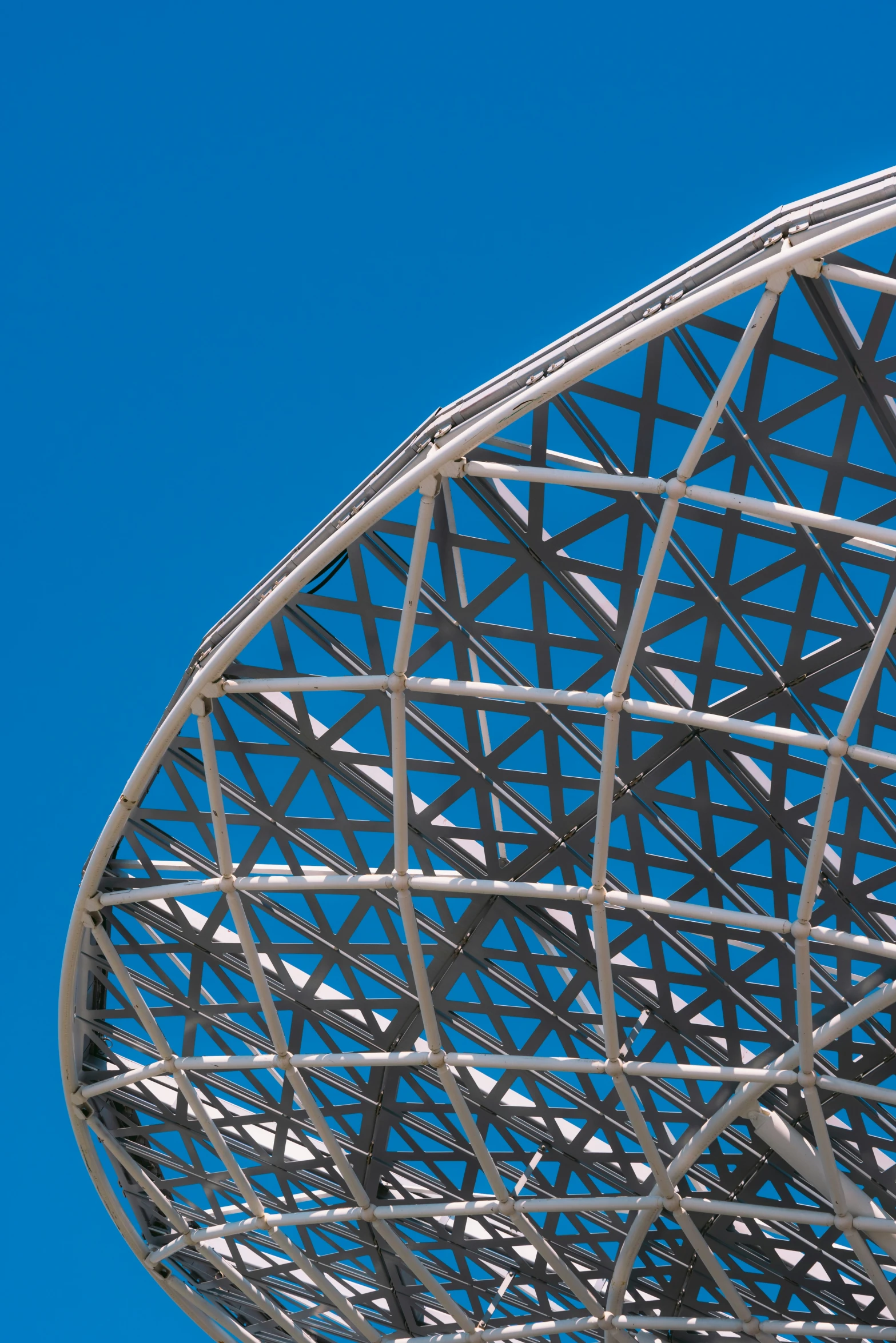 a metal structure on top of a building on a clear day