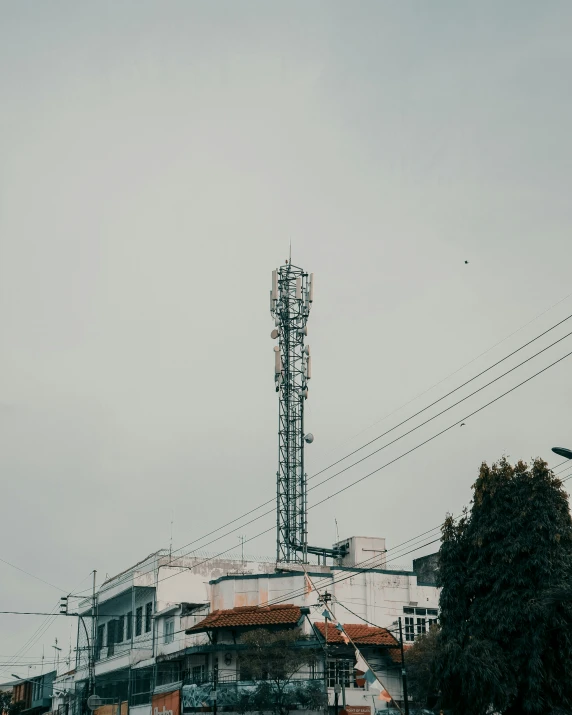 an old looking tower with lights sitting on top of it