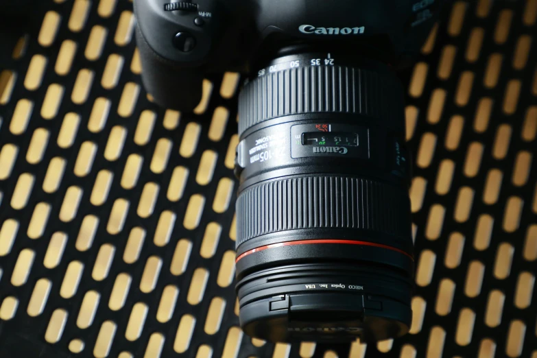 the canon 24 - 70mm lens sits on a table